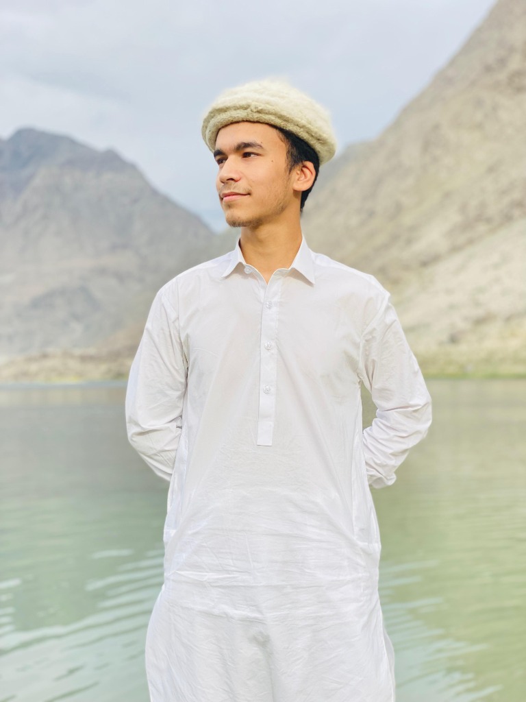 Founder of Savor of Baltistan standing on Karakoram mountain ridge